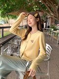 Korean Yellow Embroidered Long-Sleeved Collar Knitted Cardigan Women 2026 Early Autumn Wearing A Languid Wind Loose Top